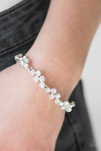 Load image into Gallery viewer, Paparazzi Still GLOWING Strong - White Rhinestones - Silver Glittery GORGEOUS - Timeless Bracelet - $5 Jewelry With Ashley Swint