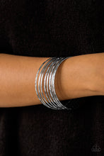Load image into Gallery viewer, Paparazzi Magnificent Gleam - Silver Bangles - Set of 8 Bracelets - $5 Jewelry with Ashley Swint
