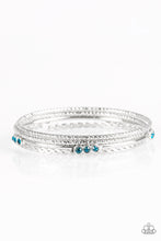 Load image into Gallery viewer, Paparazzi Subtle Shimmer - Blue Rhinestones - Set of 4 Bangle Bracelets - $5 Jewelry With Ashley Swint