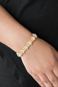 Paparazzi Strut Your Stuff - Gold - White Rhinestones - Stretchy Bracelet - $5 Jewelry with Ashley Swint