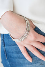 Load image into Gallery viewer, Paparazzi Subtle Shimmer - White Rhinestones - Silver Bangle Bracelets - Set of 4 - $5 Jewelry With Ashley Swint